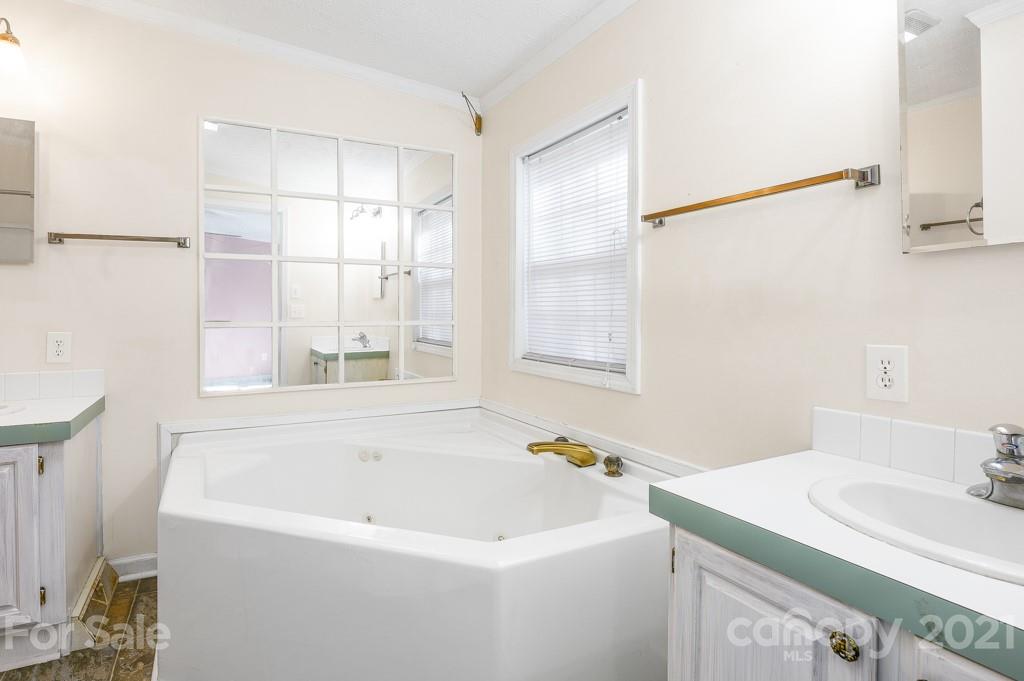 151 Butternut Lane Rutherfordton, NC 28139 - Photo 13 of 24 a bathroom with a sink and a bathtub