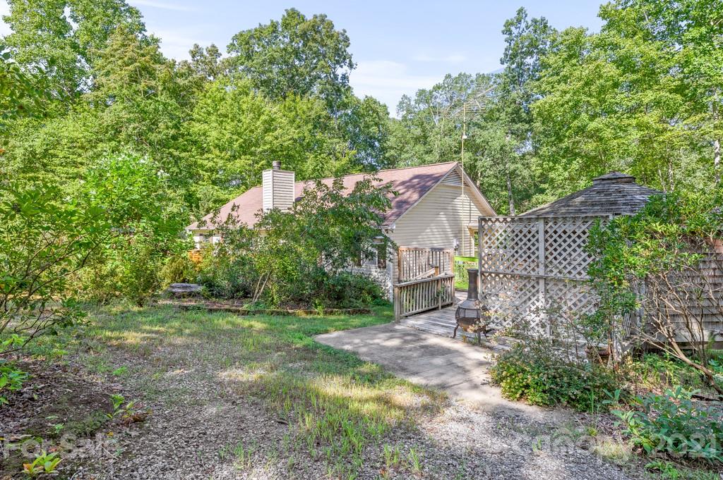 151 Butternut Lane Rutherfordton, NC 28139 - Photo 24 of 24 a view of a yard in front of a house with large trees