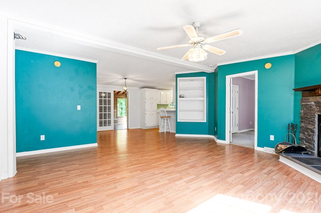 151 Butternut Lane Rutherfordton, NC 28139 - Photo 4 of 24 a view of an empty room with window and wooden floor