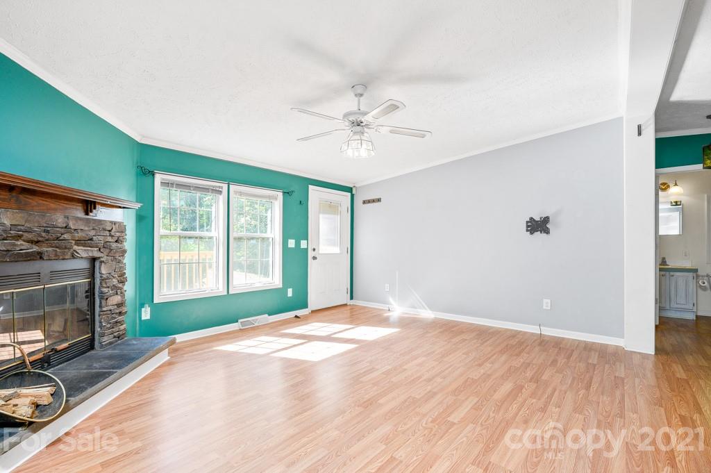 151 Butternut Lane Rutherfordton, NC 28139 - Photo 5 of 24 a bedroom with a bed and a fireplace