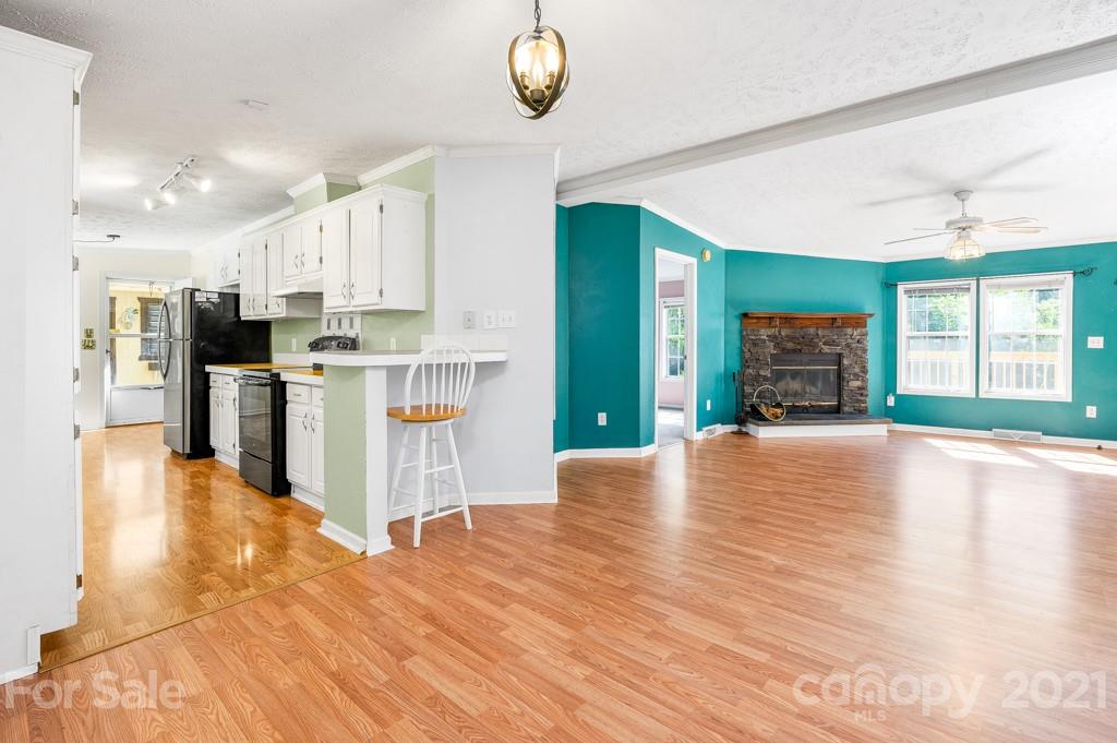 151 Butternut Lane Rutherfordton, NC 28139 - Photo 6 of 24 a view of a kitchen with kitchen island a counter top space appliances and cabinets