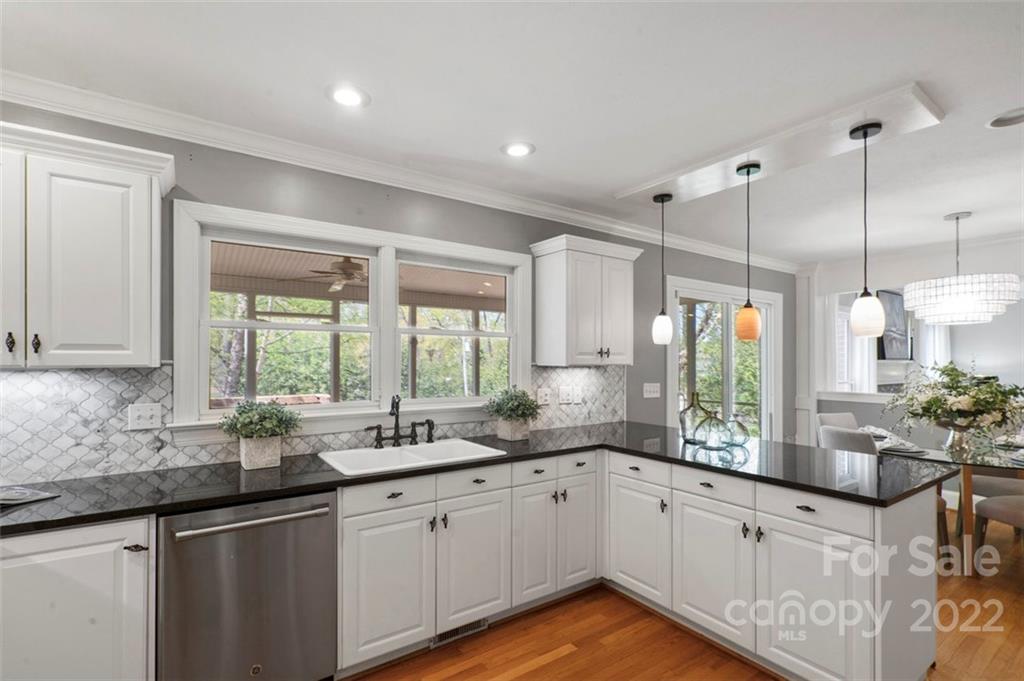 1435 Lilac Road Charlotte, NC 28209 - Photo 13 of 33 a kitchen with sink stove and cabinets