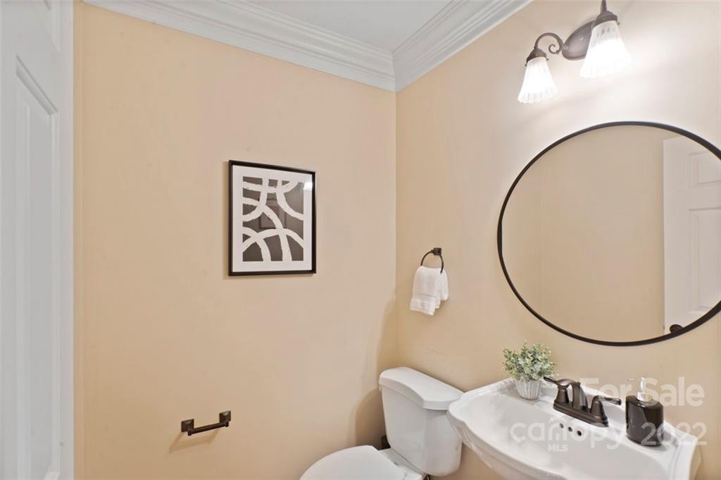 1435 Lilac Road Charlotte, NC 28209 - Photo 16 of 33 a bathroom with a sink mirror and toilet