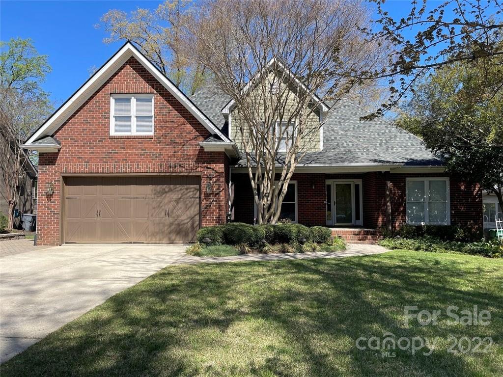 1435 Lilac Road Charlotte, NC 28209 - Photo 2 of 33 a front view of a house with a yard