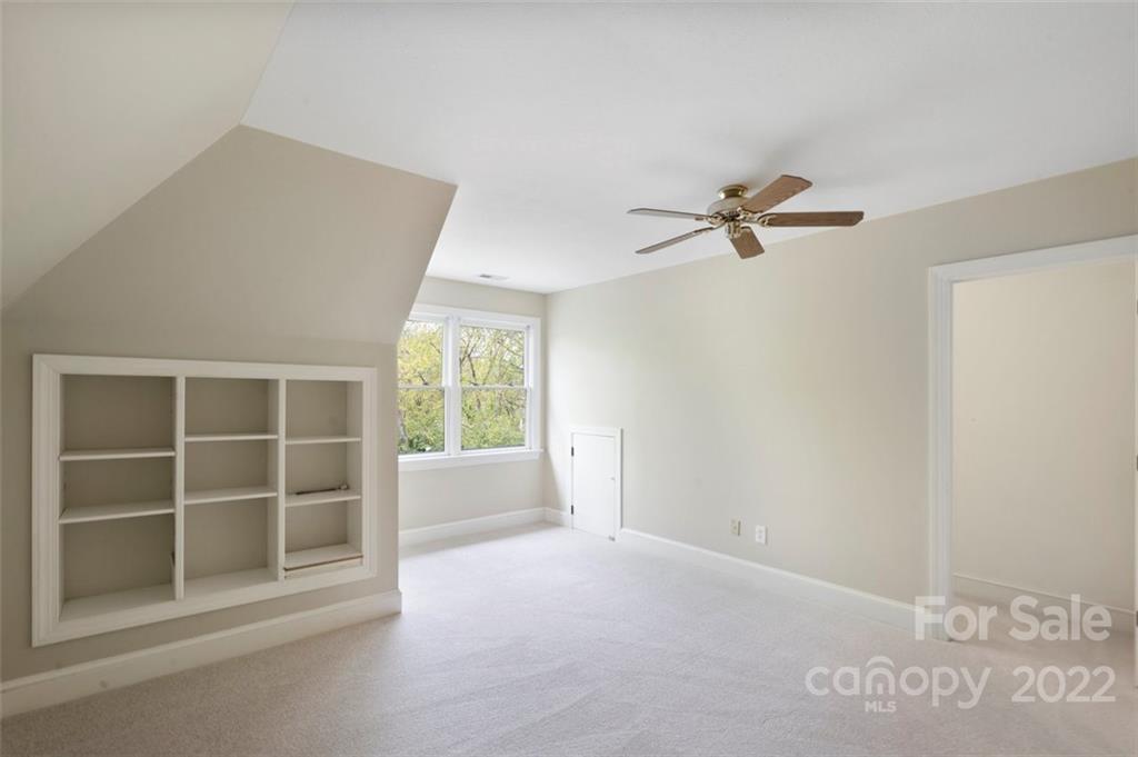 1435 Lilac Road Charlotte, NC 28209 - Photo 22 of 33 a view of an empty room with a window