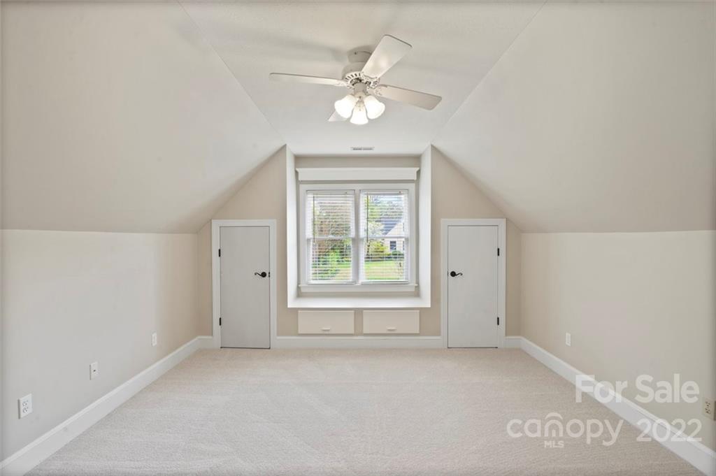 1435 Lilac Road Charlotte, NC 28209 - Photo 23 of 33 a view of an empty room with a window
