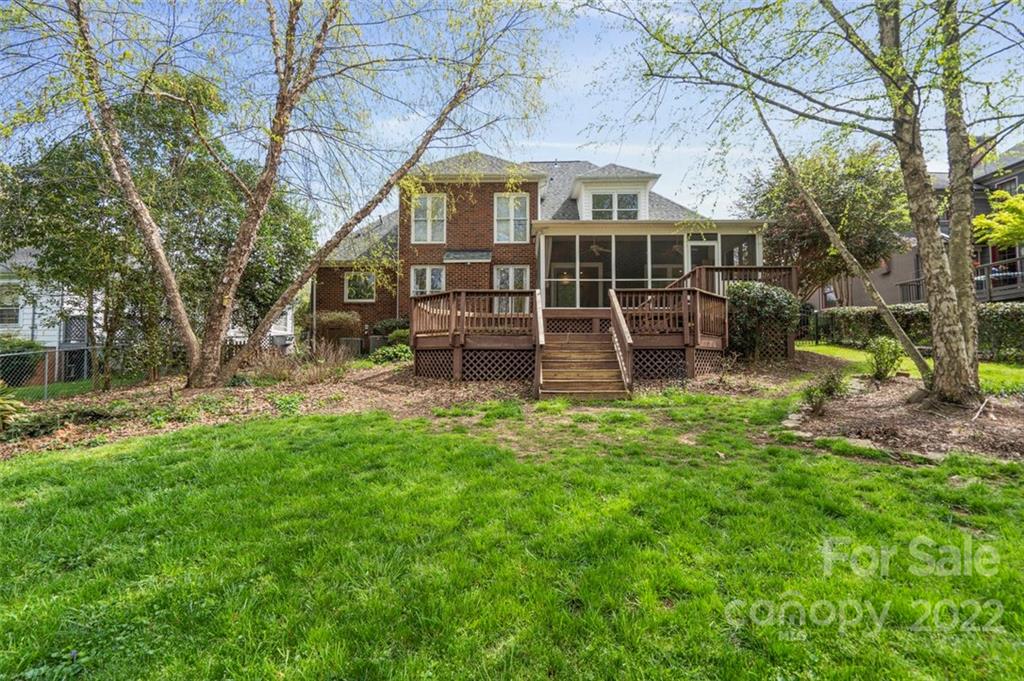 1435 Lilac Road Charlotte, NC 28209 - Photo 30 of 33 a view of a house with backyard porch and sitting area