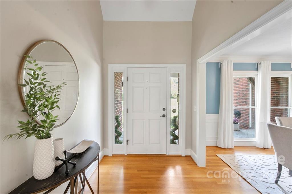 1435 Lilac Road Charlotte, NC 28209 - Photo 6 of 33 a view of an entryway with wooden floor
