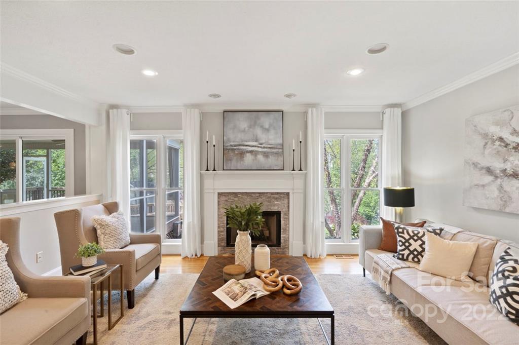 1435 Lilac Road Charlotte, NC 28209 - Photo 7 of 33 a living room with furniture and a fireplace