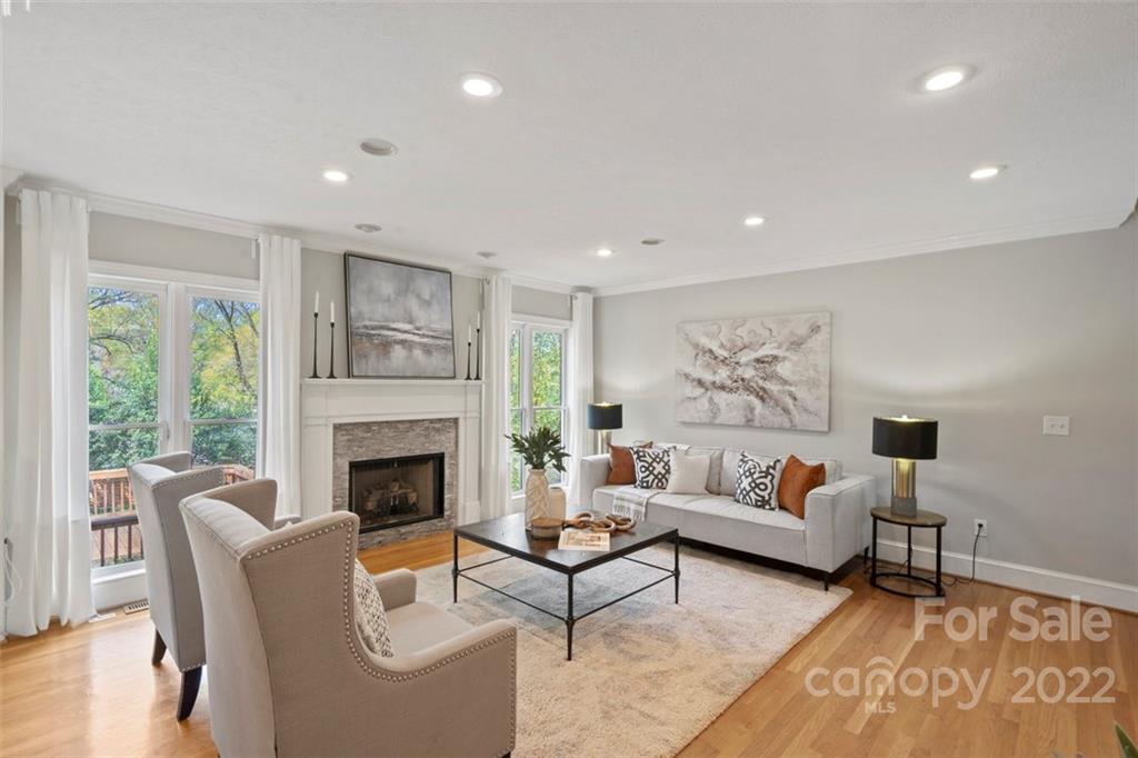 1435 Lilac Road Charlotte, NC 28209 - Photo 8 of 33 a living room with furniture and a fireplace