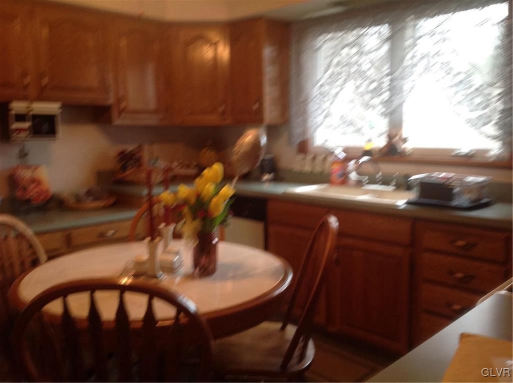 56 Ridgewood Road Easton, PA 18045 - Photo 16 of 19 a view of a dining room with furniture and chandelier