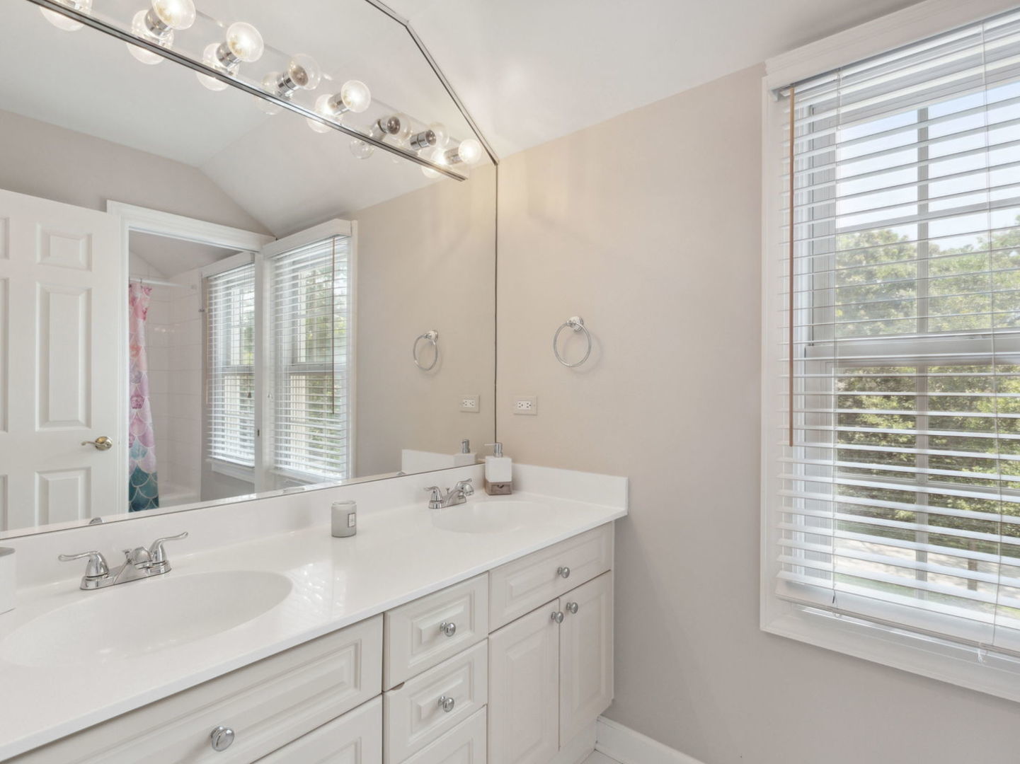 1170 Griffith Road Lake Forest, IL 60045 - Photo 16 of 34 a bathroom with a sink double vanity and a mirror