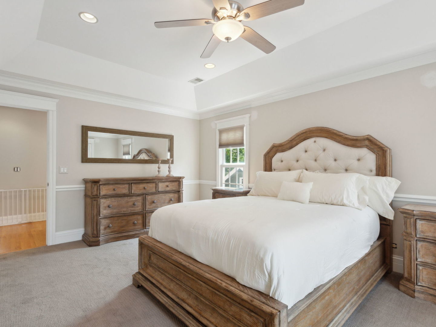 1170 Griffith Road Lake Forest, IL 60045 - Photo 21 of 34 a bedroom with a large bed and a chandelier