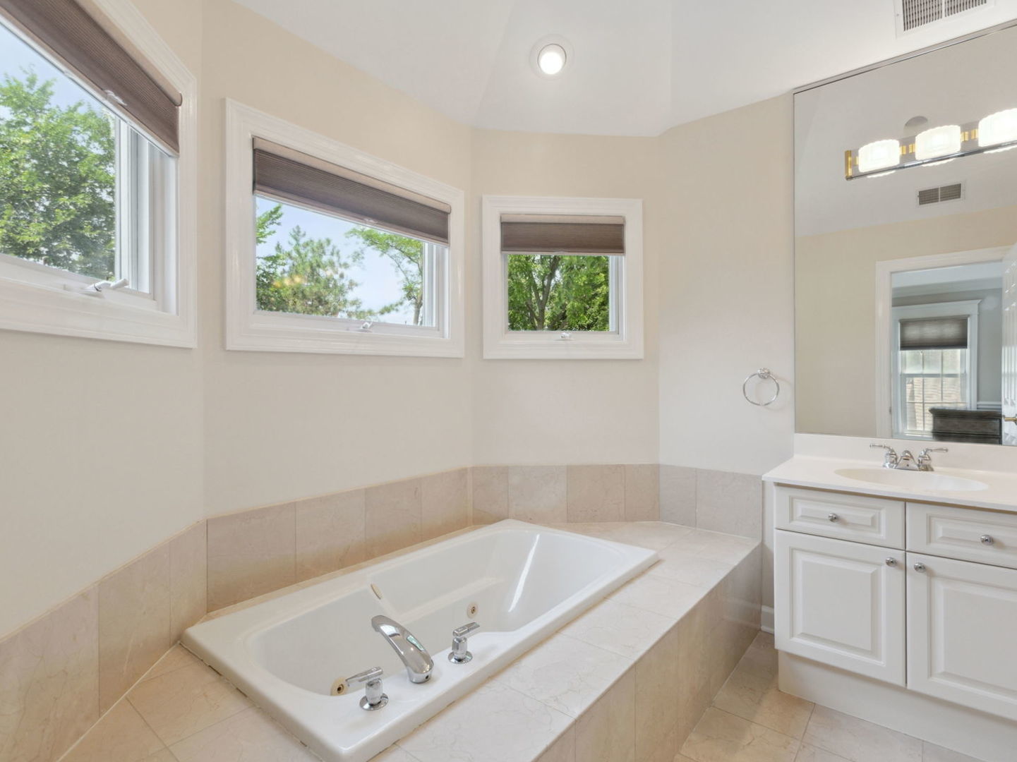 1170 Griffith Road Lake Forest, IL 60045 - Photo 26 of 34 a bathroom with a tub a sink and a window