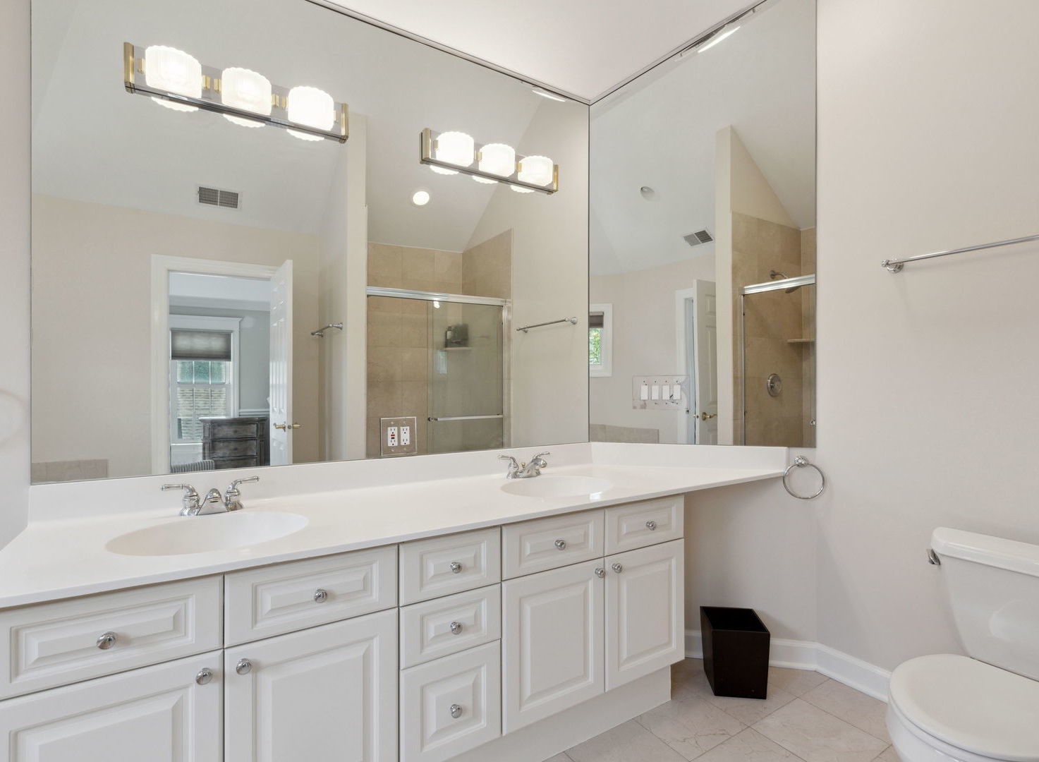 1170 Griffith Road Lake Forest, IL 60045 - Photo 27 of 34 a bathroom with a granite countertop sink a toilet and a mirror