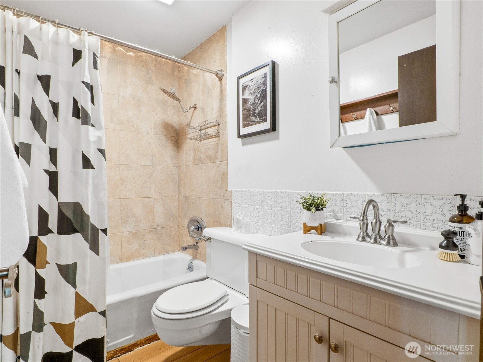 64642 Northeast 178th Street Baring, WA 98251 - Photo 20 of 40 a bathroom with a sink a toilet and a shower curtain