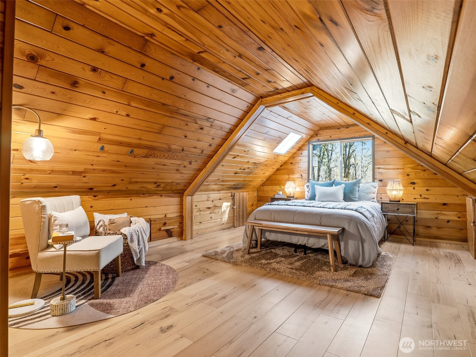64642 Northeast 178th Street Baring, WA 98251 - Photo 23 of 40 a bedroom with furniture and wooden floor