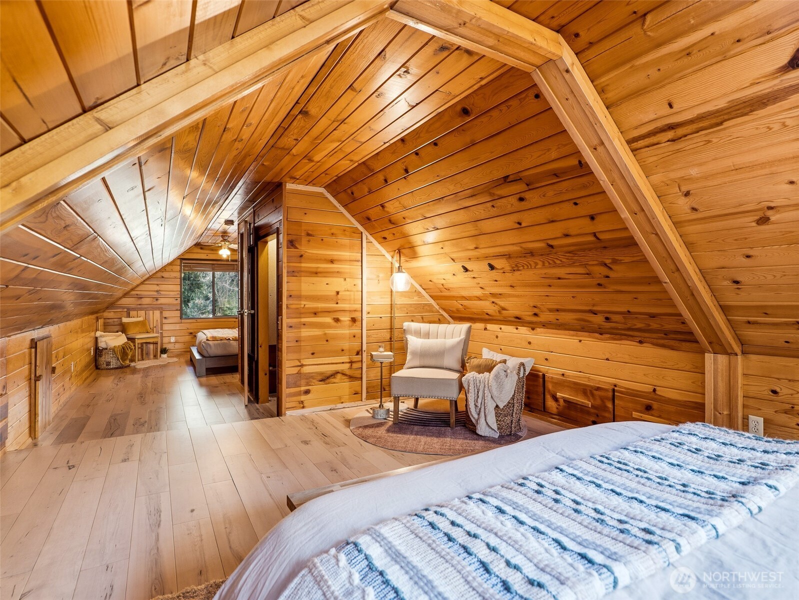 64642 Northeast 178th Street Baring, WA 98251 - Photo 26 of 40 a bedroom with a bed and wooden floor