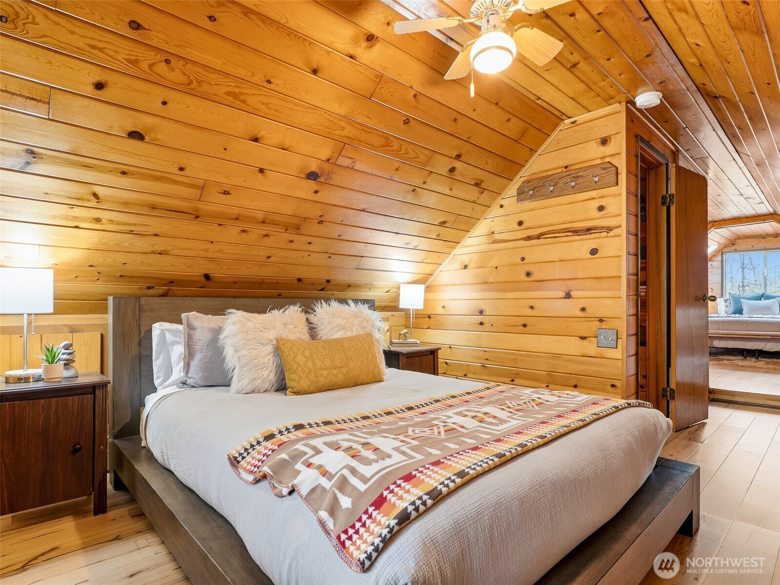 64642 Northeast 178th Street Baring, WA 98251 - Photo 27 of 40 a bedroom with a bed and a night stand