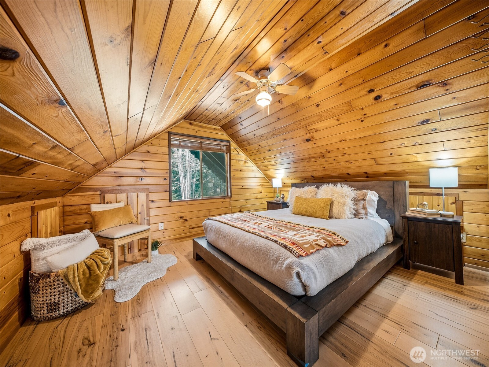 64642 Northeast 178th Street Baring, WA 98251 - Photo 28 of 40 a bedroom with a bed and wooden balcony