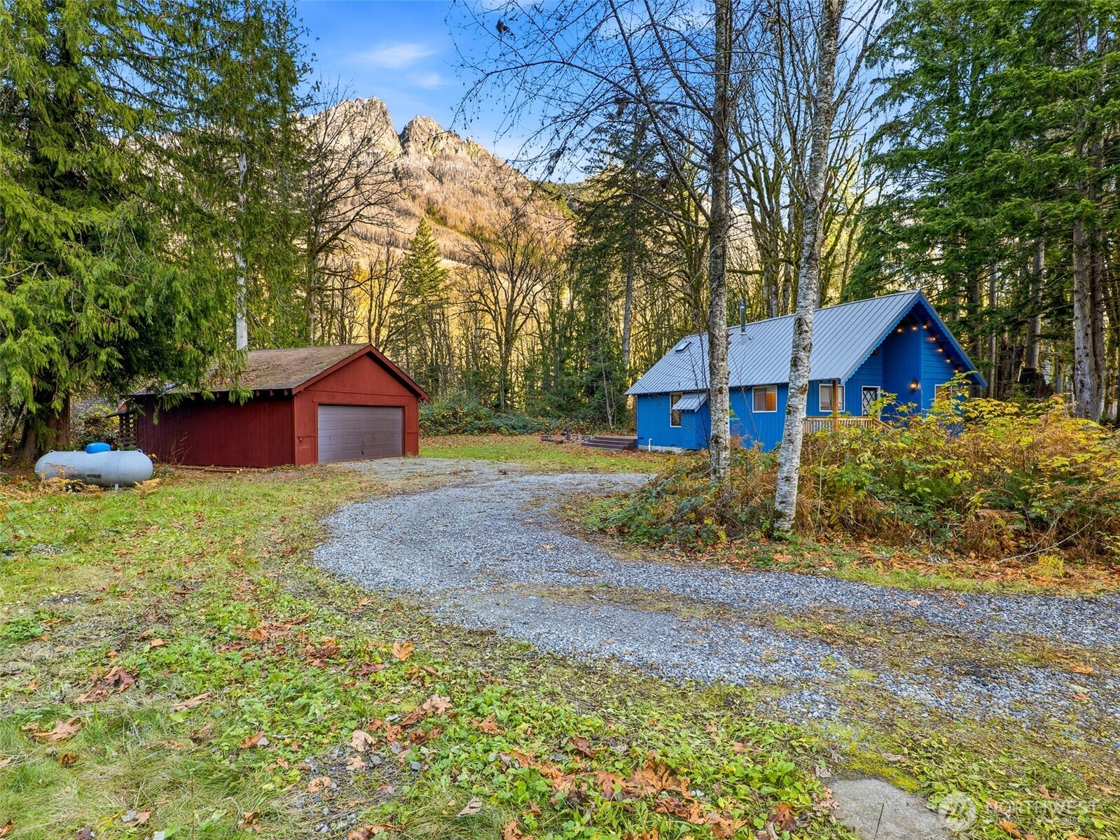 64642 Northeast 178th Street Baring, WA 98251 - Photo 35 of 40 a front view of a house with a yard and large trees