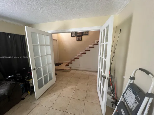 a view of a storage & utility room with stairs