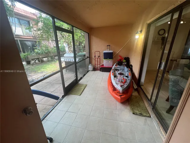 a view of a backyard with sitting area