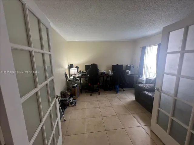 a view of a livingroom with furniture and a window