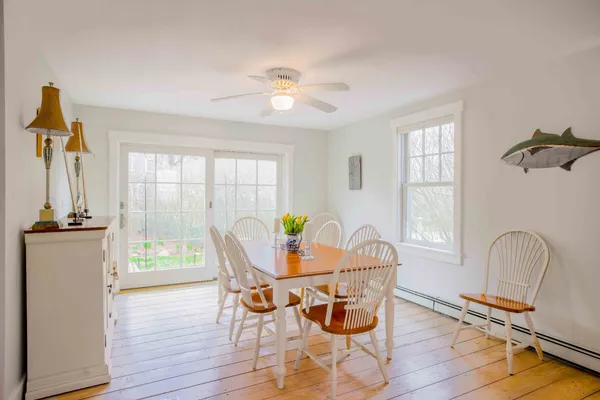 a dining room with furniture and window