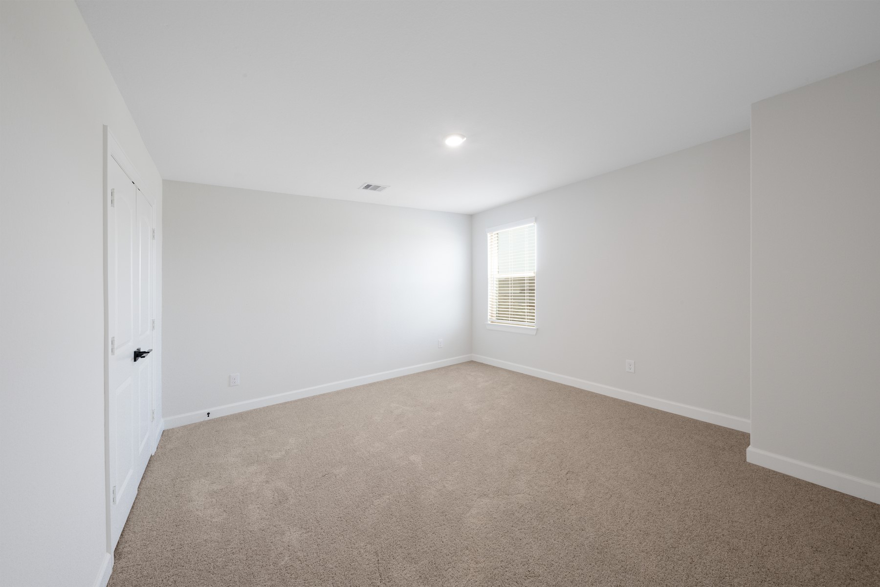 6213 White Spruce Drive Conroe, TX 77304 - Photo 12 of 21 a view of an empty room with a window