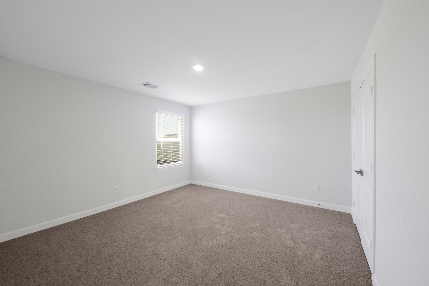 6213 White Spruce Drive Conroe, TX 77304 - Photo 13 of 21 a view of an empty room with a window