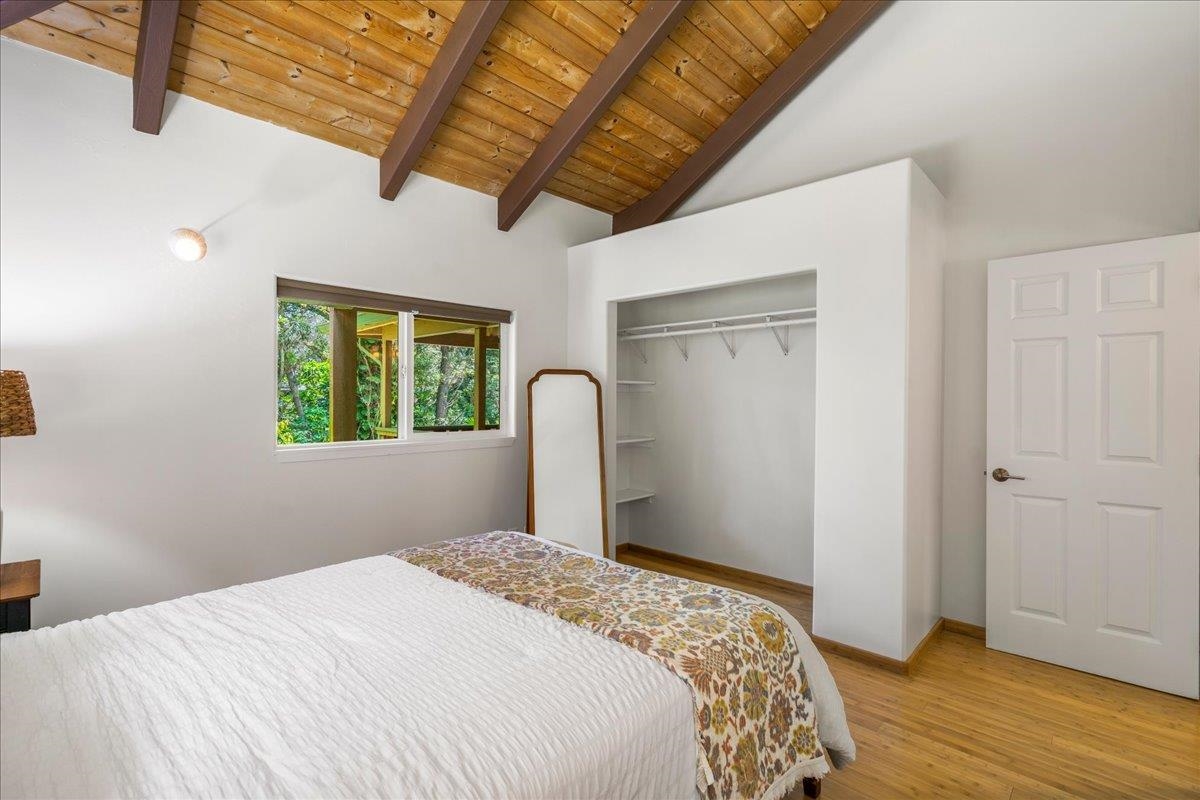 4510 Waha Place, Unit 2 Haiku, HI 96708 - Photo 16 of 36 a bedroom with bed and a window