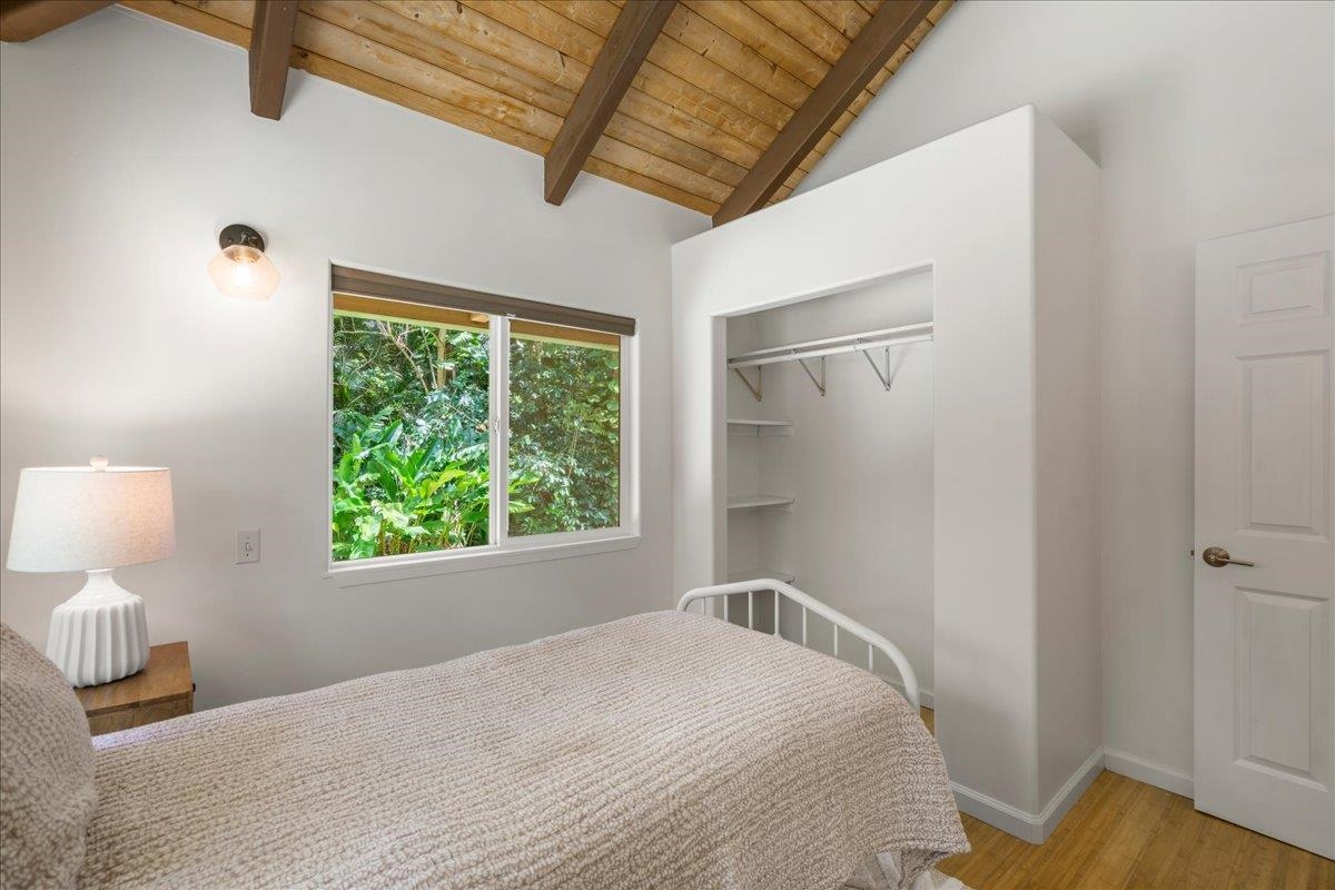 4510 Waha Place, Unit 2 Haiku, HI 96708 - Photo 19 of 36 a bedroom with a bed and a lamp