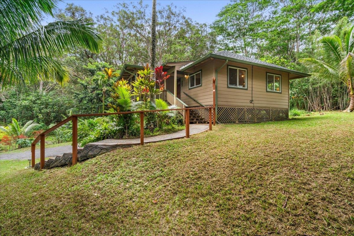 4510 Waha Place, Unit 2 Haiku, HI 96708 - Photo 30 of 36 a house with trees in the background