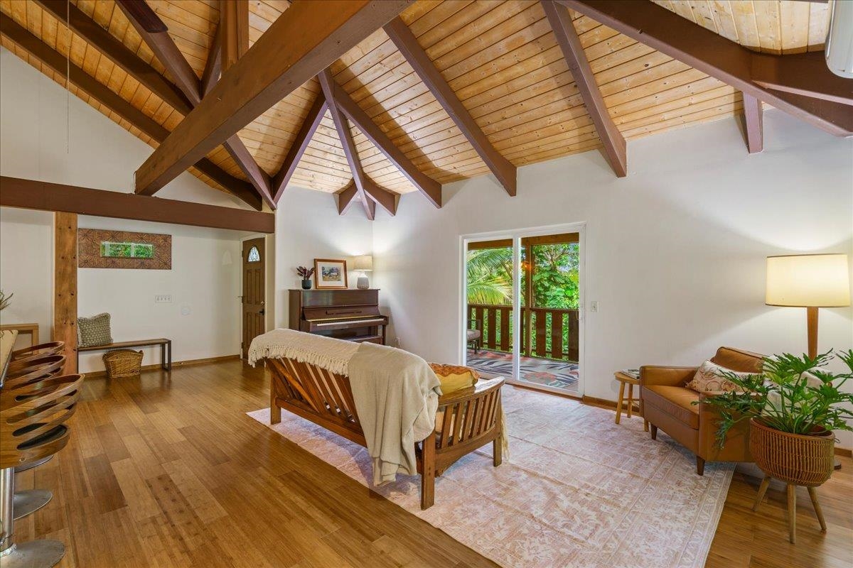 4510 Waha Place, Unit 2 Haiku, HI 96708 - Photo 7 of 36 a spacious bedroom with a bed wooden floor and window