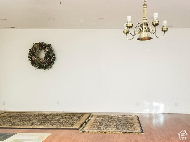 2855 South 1000 West Perry, UT 84302 - Photo 64 of 142 Detailed view of wood finished floors and a chandelier in the Great Room.