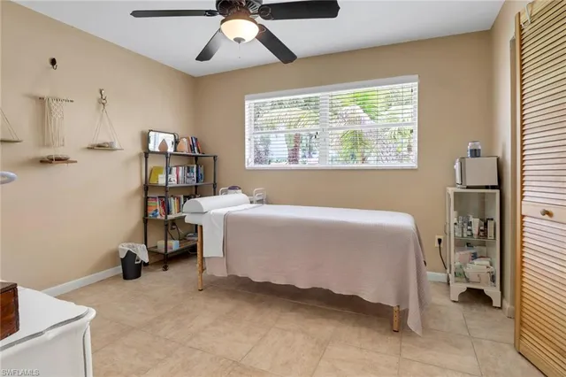 a bed room with a bed and a book shelf