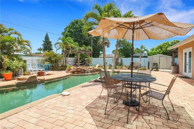 a view of a backyard with sitting area