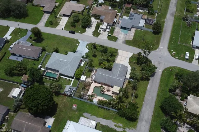 an aerial view of residential houses with outdoor space