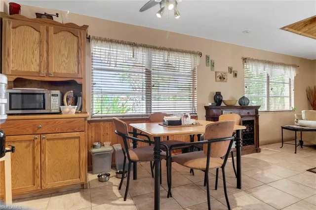 a view of a dining room with furniture and window