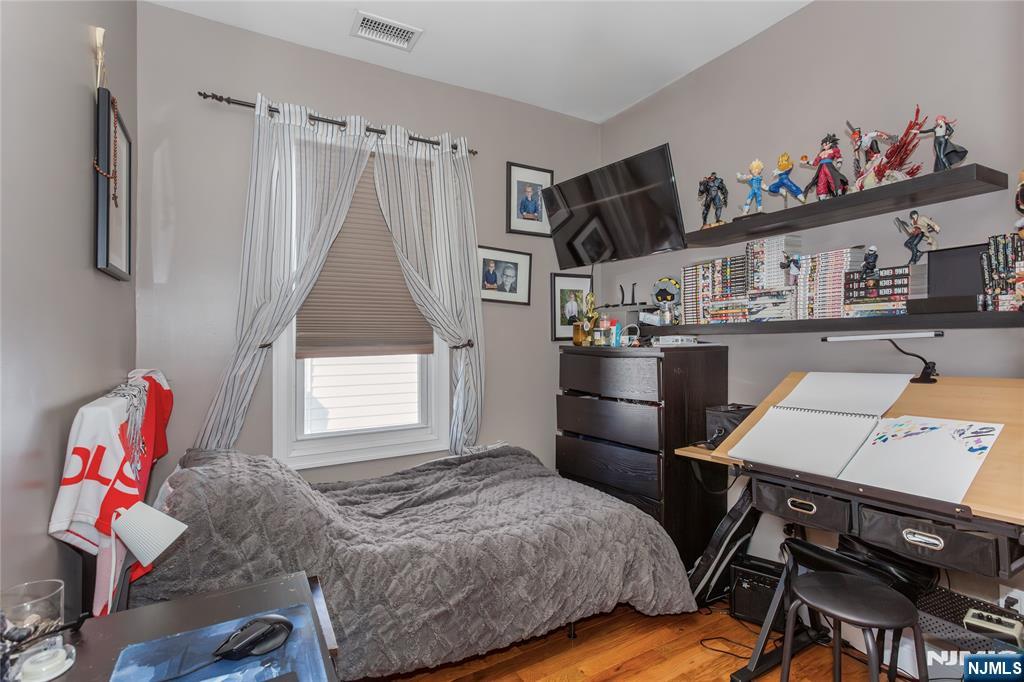 204 Hayward Place Wallington, NJ 07057 - Photo 23 of 39 a bedroom with a bed and a window
