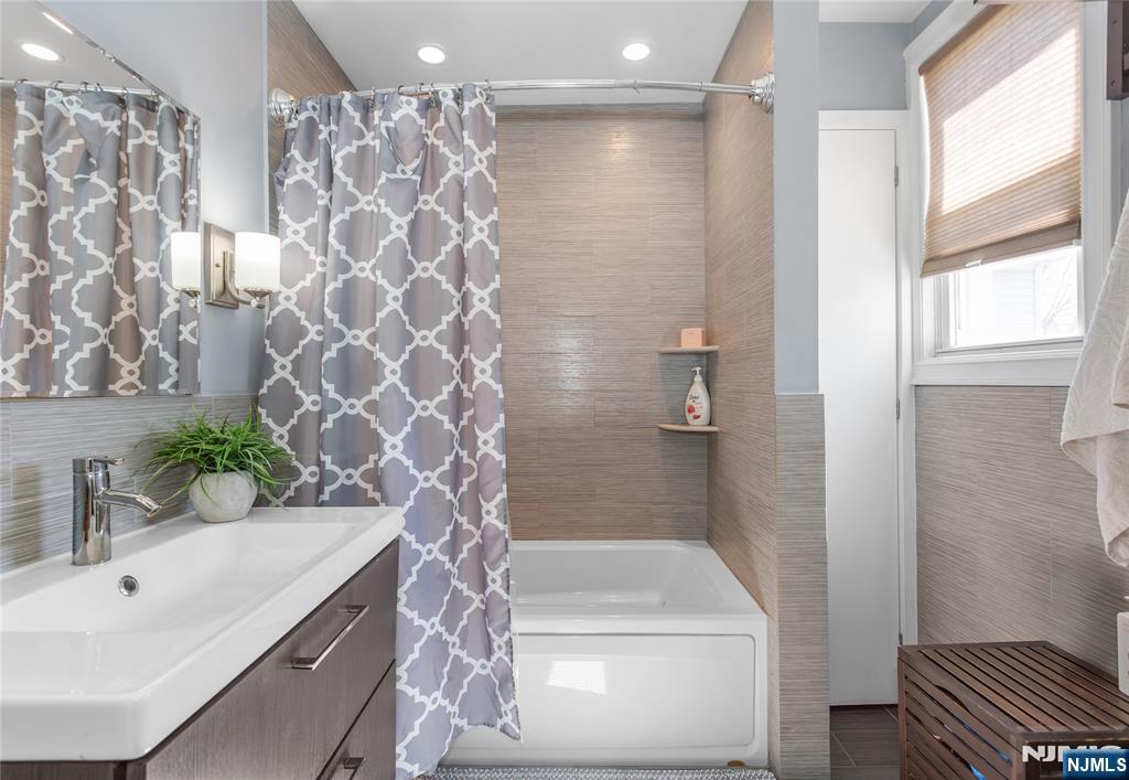 204 Hayward Place Wallington, NJ 07057 - Photo 24 of 39 a bathroom with a sink and a mirror