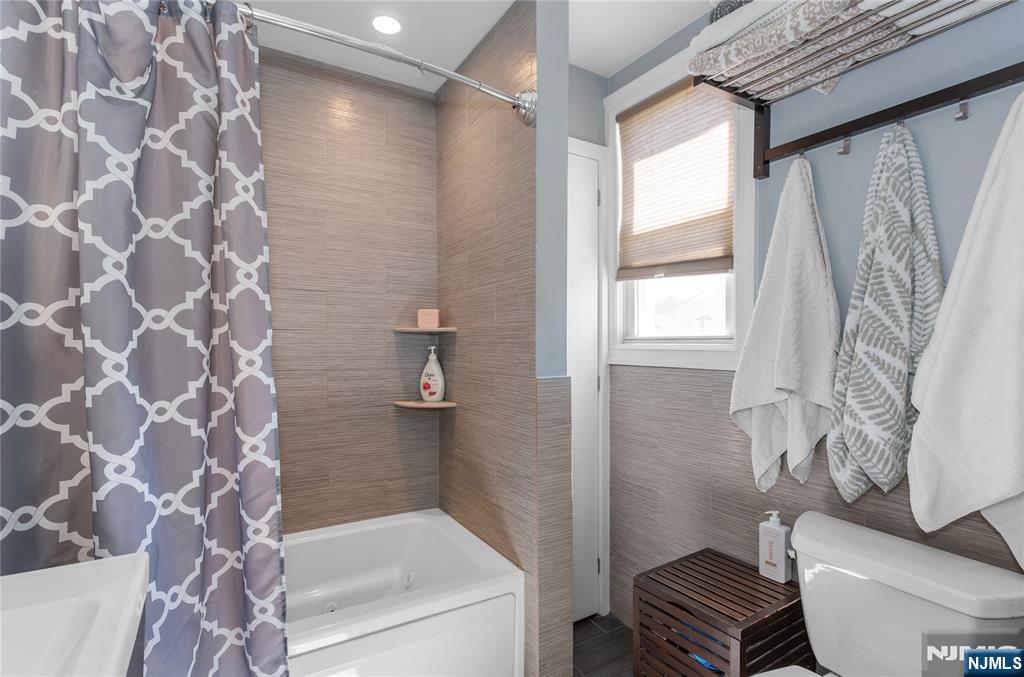 204 Hayward Place Wallington, NJ 07057 - Photo 26 of 39 a bathroom with a bathtub and shower