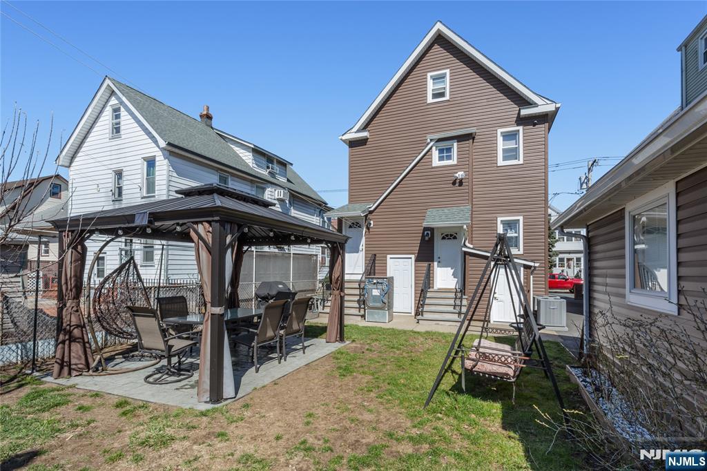 204 Hayward Place Wallington, NJ 07057 - Photo 37 of 39 a view of a house with a wooden deck