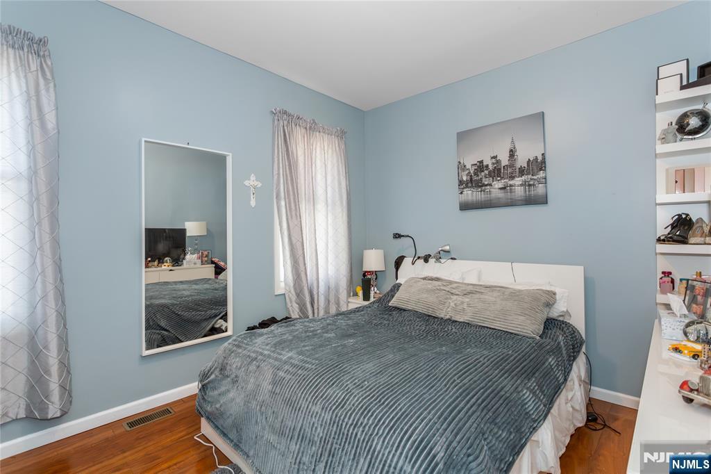 204 Hayward Place Wallington, NJ 07057 - Photo 8 of 39 a bedroom with a bed and a window