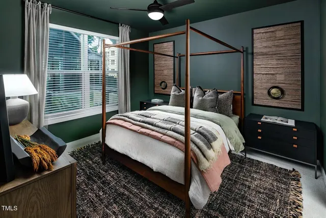 a bed room with a bed and a television