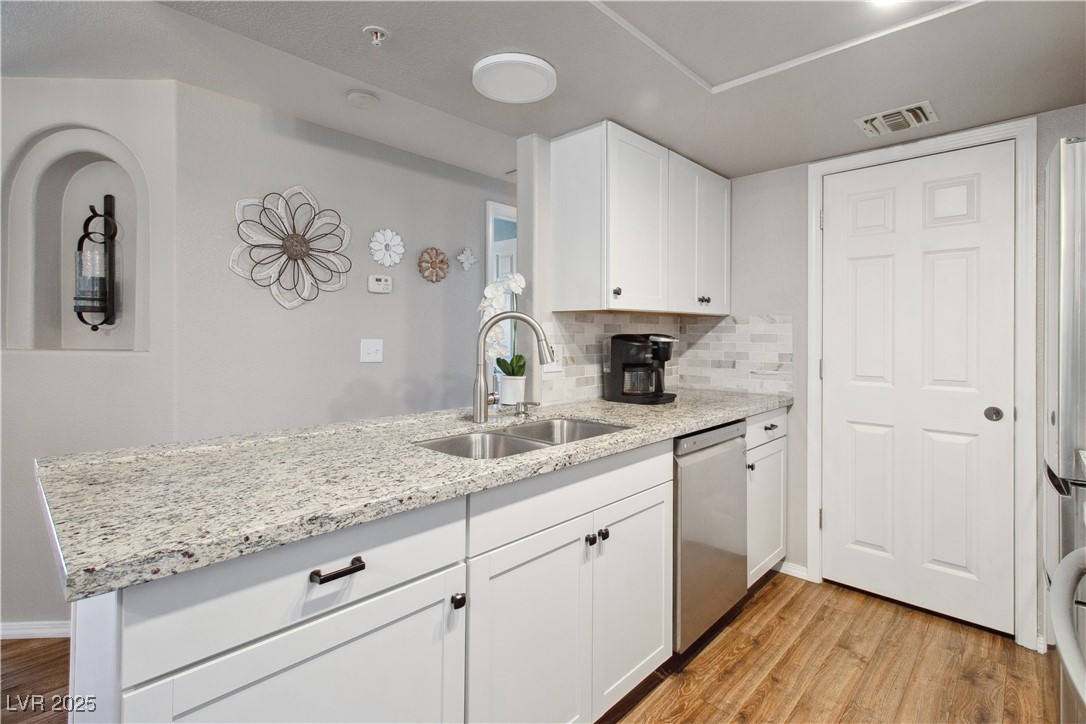 3550 Bay Sands Drive, Unit 2101 Laughlin, NV 89029 - Photo 9 of 49 The Kitchen also has a stainless steel Dishwasher, and a large dual-basin stainless steel sink. Also pictured is the Pantry door.