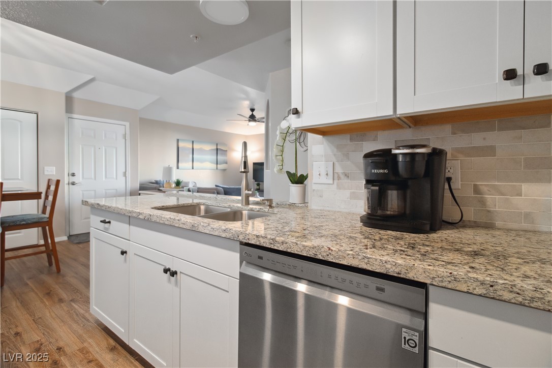 3550 Bay Sands Drive, Unit 2101 Laughlin, NV 89029 - Photo 10 of 49 Here we have a closer view of the granite countertops, tile backsplash, the stainless steel Dishwasher, and the large dual-basin stainless steel sink.