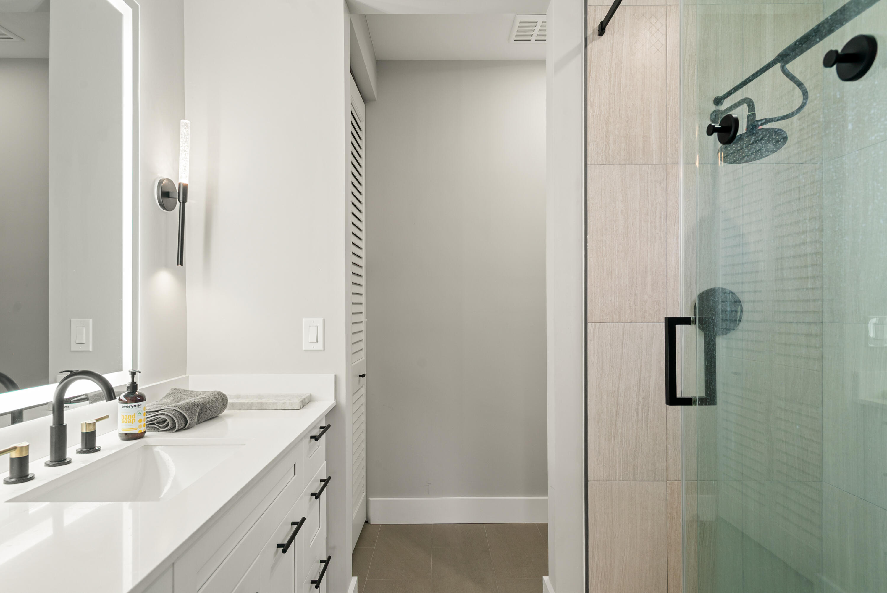 13 Coral Way Key Largo, FL 33037 - Photo 13 of 34 a bathroom with a double vanity sink a mirror and shower