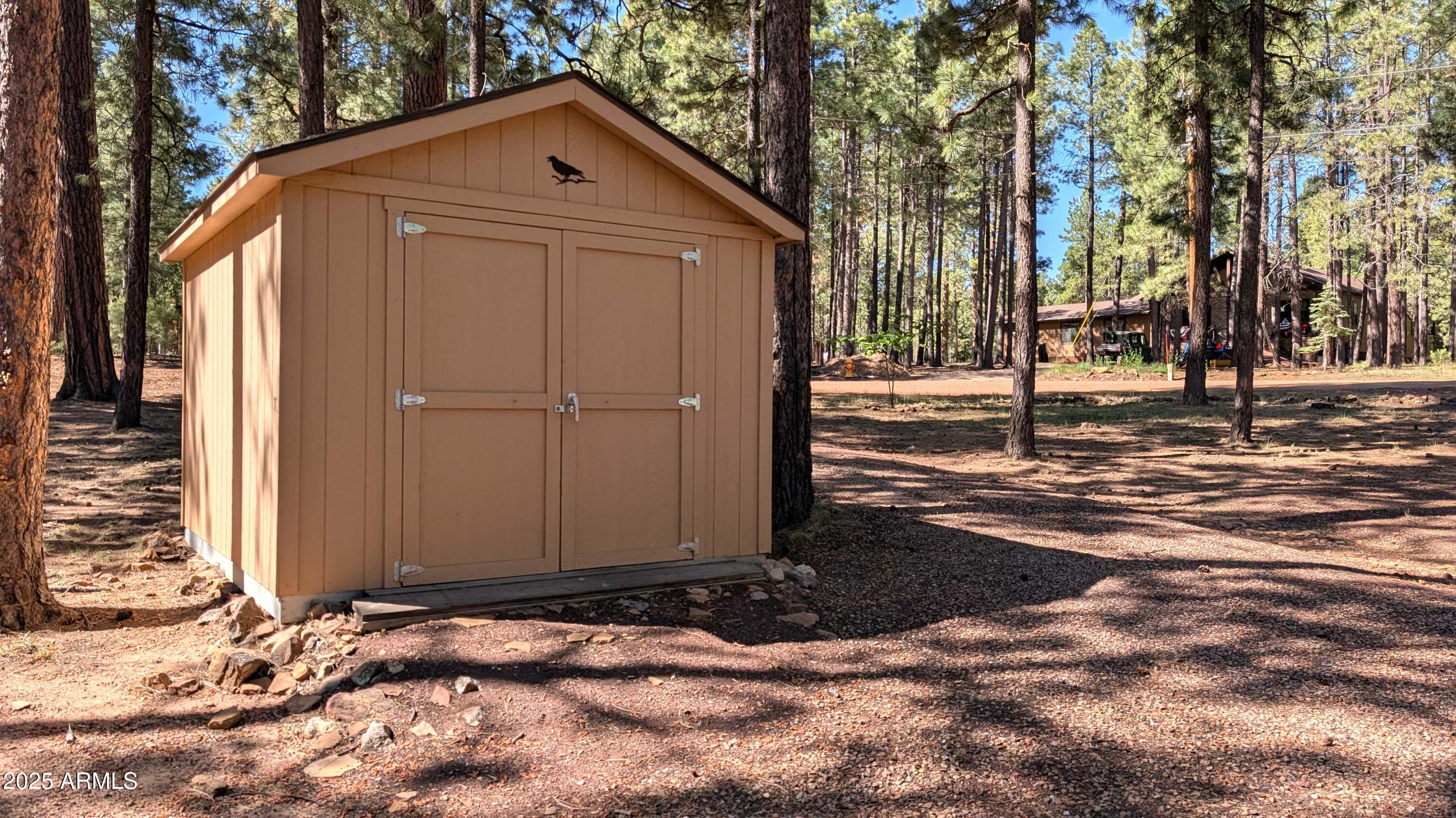 2425 Tall Trees Loop Forest Lakes, AZ 85931 - Photo 35 of 43 a front view of a house with a yard